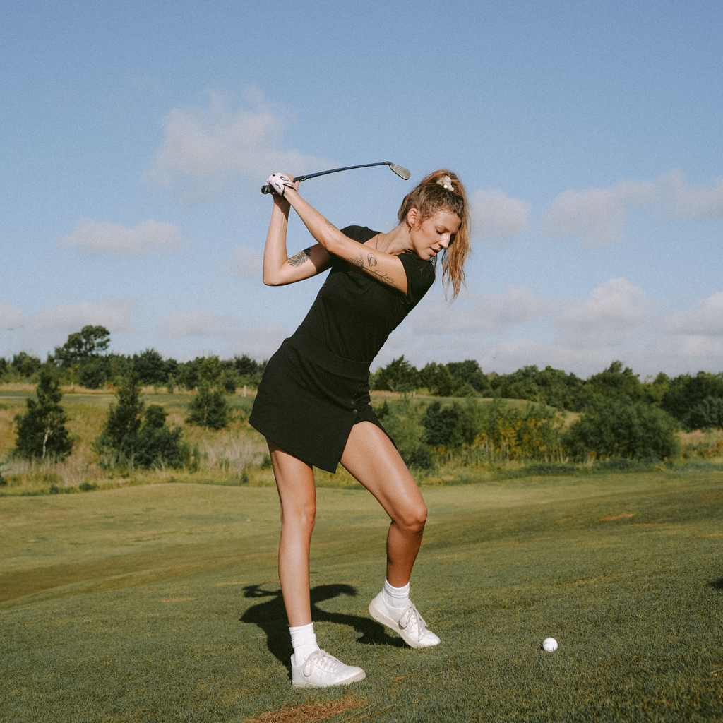 Women's golf apparel; skorts, tops, dresses, pants, and more.